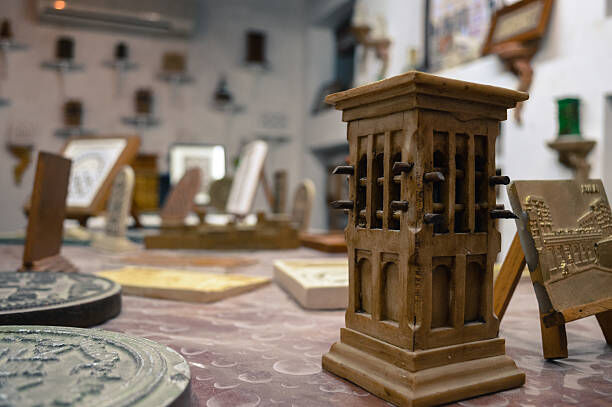 Image of an antique wooden chair being repaired.